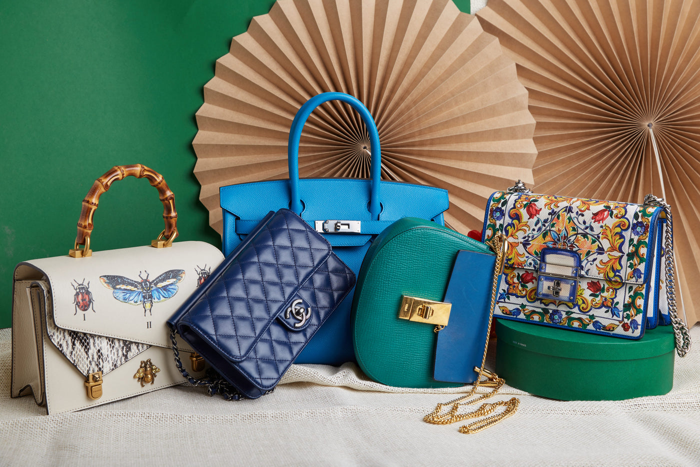 the relationship between designer handbags and the concept of luxury?